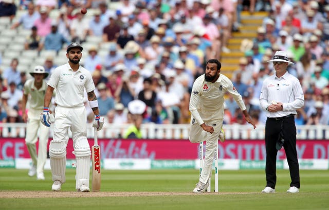 Adil Rashid, centre, has played 15 Tests for England