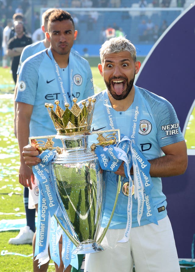 Sergio Aguero holds the Premier League trophy