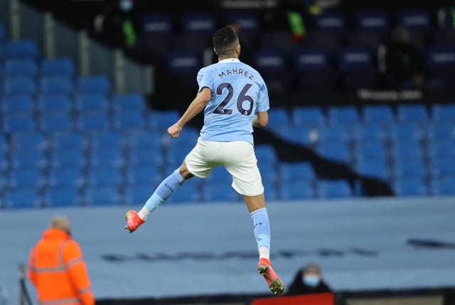 Riyad Mahrez celebrates scoring for City