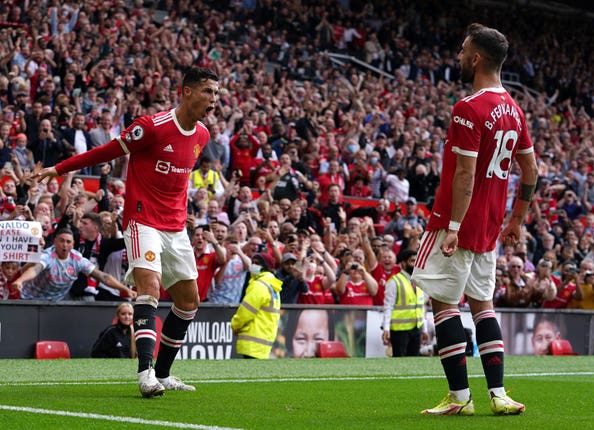 Cristiano Ronaldo, left, celebrates a goal with compatriot Bruno Fernandes