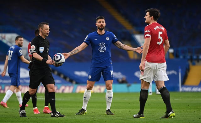 Chelsea’s Olivier Giroud remonstrates with Harry Maguire