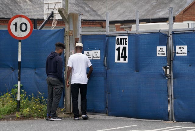 People outside asylum accommodation