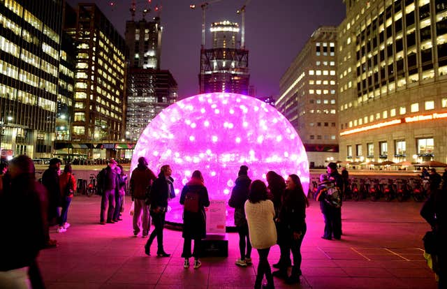 Members of the public look upon Sonic Light Bubble (Ian West/PA)
