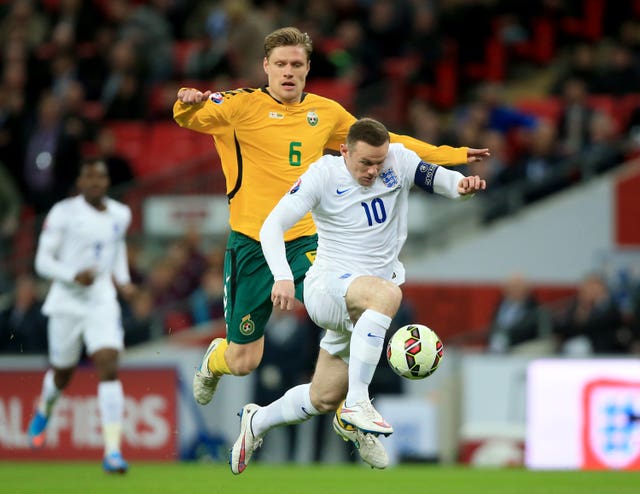 Zaliukas in action against England's Wayne Rooney