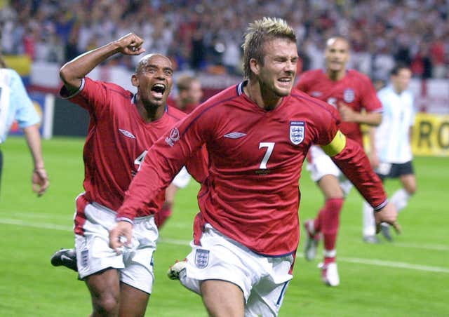 David Beckham rushes off to celebrate after scoring a penalty against Argentina in the 2002 World Cup