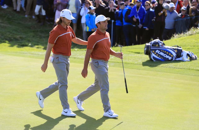 Tommy Fleetwood and Francesco Molinari walk off a green together