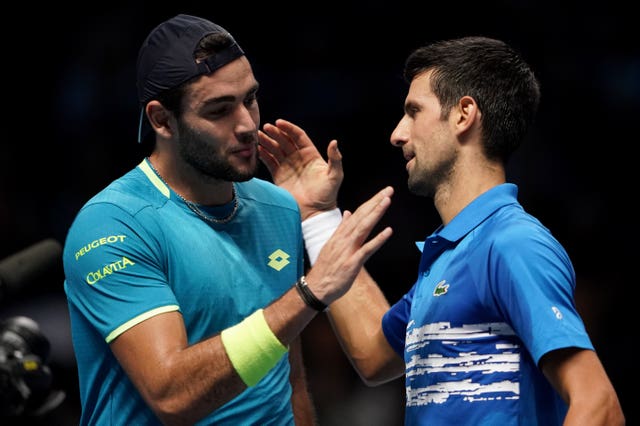 Matteo Berrettini (left) and Novak Djokovic shake hands at the end of their match