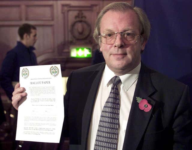 Gordon Taylor with the ballot paper during a press conference in Manchester where he announced that over 99 per cent of his members had voted in favour of strike action in 2001 