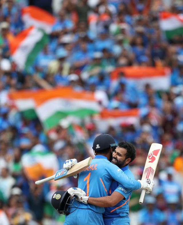 Rohit Sharma, right, celebrates his century with opening partner KL Rahul