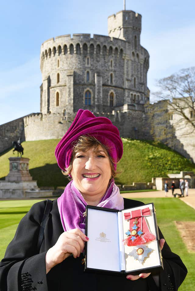 Co-founder of the Ambassador Theatre Group Limited, Rosemary Squire with her Dame Commander medal that was presented to her by Queen Elizabeth II at an Investiture ceremony at Windsor Castle.
