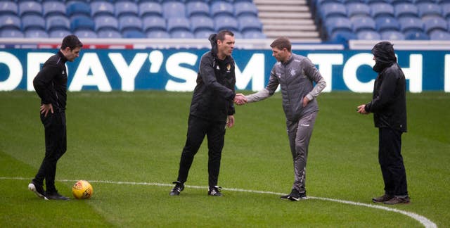 Gerrard and Saturday's referee inspect the Ibrox pitch