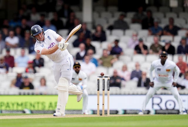 Dan Lawrence plays and misses as the ball flies past his legs and over the top of middle stump