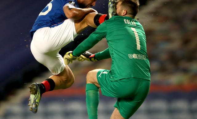 Kemar Roofe collides with Slavia Prague’s Ondrej Kolar