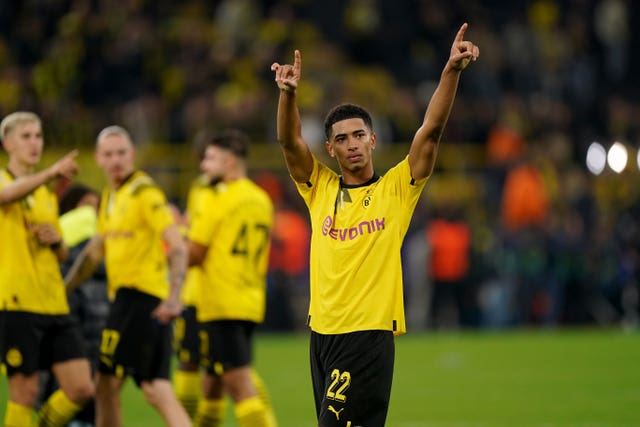 Borussia Dortmund's Jude Bellingham interacts with fans following the UEFA Champions League group G match at Signal Iduna Park in Dortmund, Germany