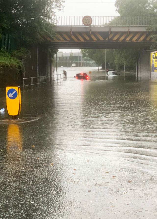 Vehicles stuck in water at Heaton Chapel in Stockport, Manchester