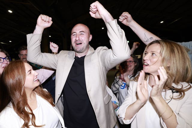 Daniel Ennis celebrating with Holly Cairns and his partner