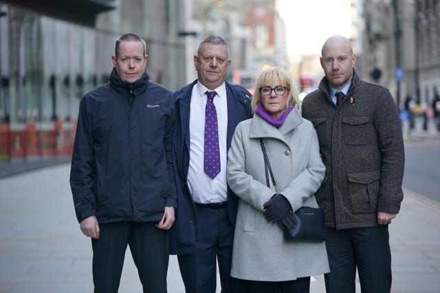 (left to right) Andrew Wails, Gary Furlong, Jan Furlong and Gary Furlong Jnr outside the Old Bailey, London, for the inquest for victims of the Reading terror attack.