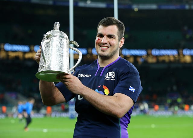 Scotland’s Stuart McInally holds the Calcutta Cup retained at Twickenham on Saturday