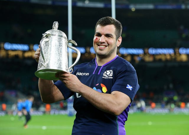 Scotland's Stuart McInally holds the Calcutta Cup retained at Twickenham on Saturday