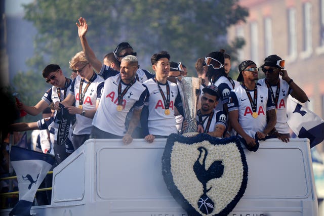 Tottenham’s Richarlison, Son Heung-Min and Dominic Solanke on the open-top team bus during the Europa League winners parade