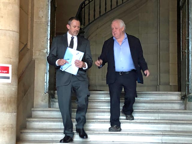 Bill Fuller (right), leaves the Cour d’Assises in Paris