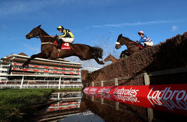 Willoughby Court and Nico de Boinville clear the water jump before going on to victory at Newbury