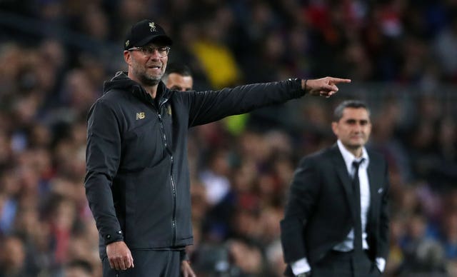 Liverpool manager Jurgen Klopp, left, has not given up on the tie 
