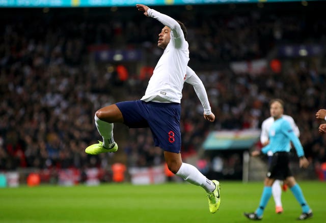 Alex Oxlade-Chamberlain celebrates scoring against Montengro