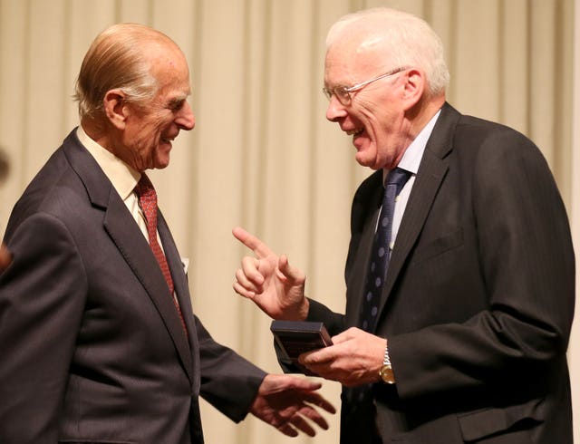 The Duke of Edinburgh presents Sir Ian Wood with a Royal Medal during a presentation at the Royal Society of Edinburgh in 2013 (Andrew Milligan/PA)