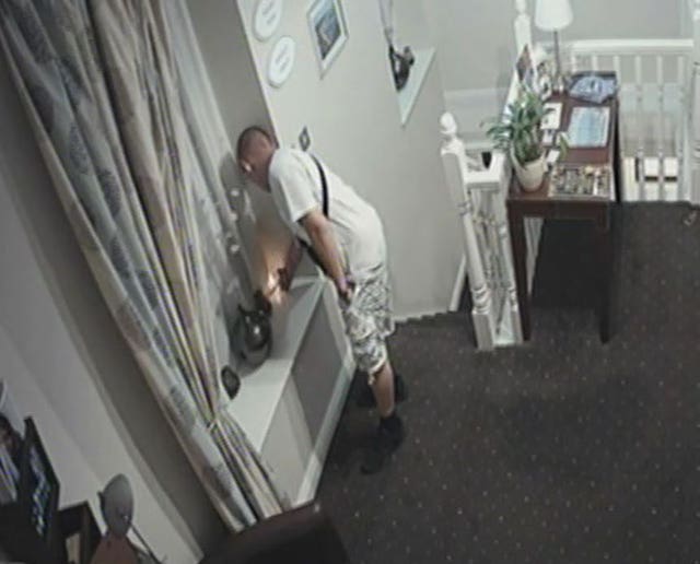 Screengrab from CCTV of Damion Harris lighting a curtain at Ty Belgrave House hotel