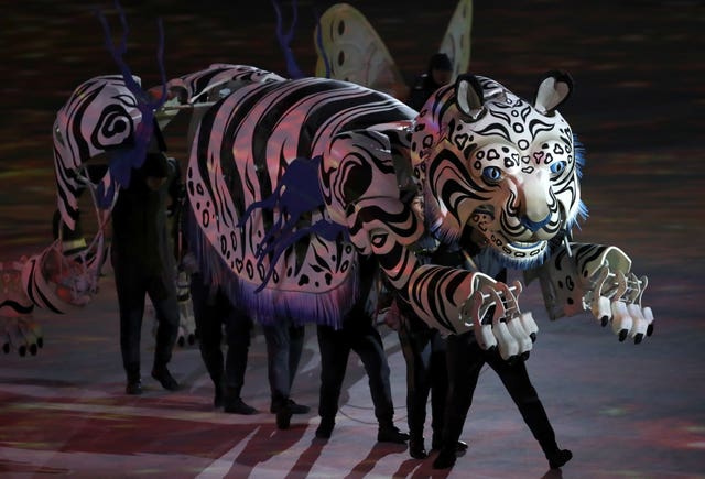 Performers in a tiger costume during the opening ceremony at the 2018 Winter Olympics in Pyeongchang