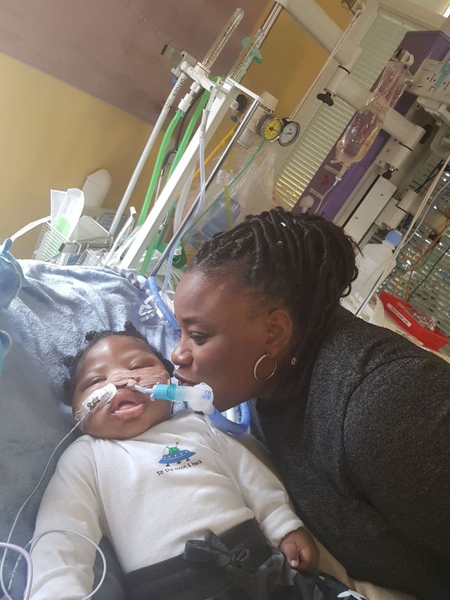 Isaiah Haastrup with his aunt Dahlia Thomas (Irwin Mitchell/PA)