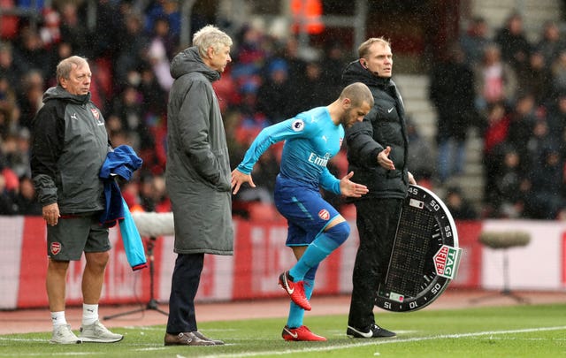 Wenger (left) and Wilshere have offered differing accounts of where negotiations are over a new contract.