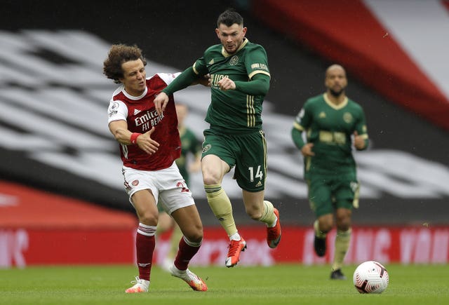 David Luiz, left, appeared to pull Oliver Burke's shirt in the second minute, who was through on goal