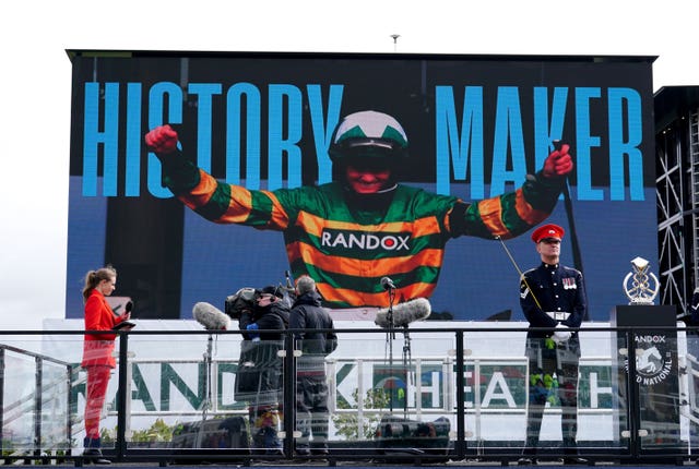 Rachael Blackmore is shown on the big screen at Aintree