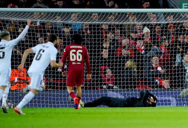 Liverpool goalkeeper Alisson Becker, right, reacts after Real Madrid’s fourth goal