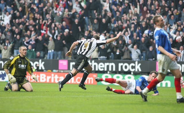 Alan Shearer celebrates after scoring his 201st goal for Newcastle to break Jackie Milburn's record