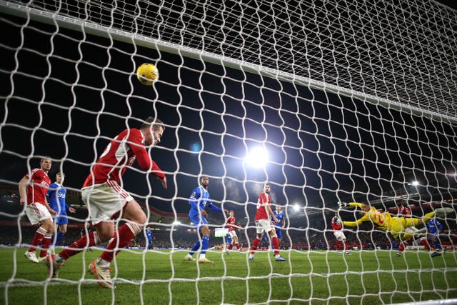 Dwight McNeil, obscured right, scores Everton''s winner