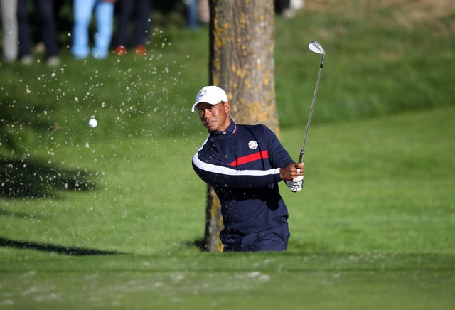 Tiger Woods practises at Le Golf National