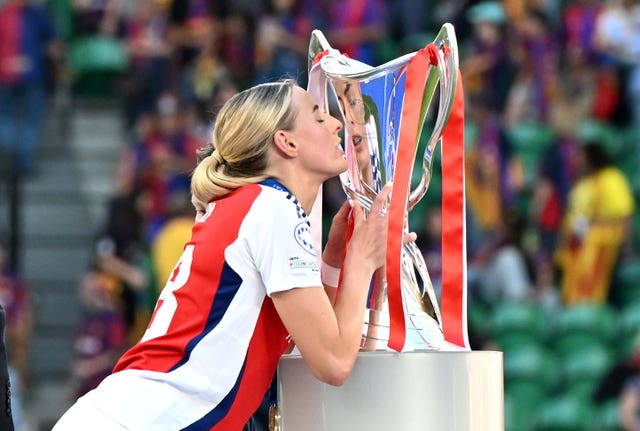 Arsenal’s Chloe Kelly kisses the trophy following victory over Barcelona in the Women’s Champions League final