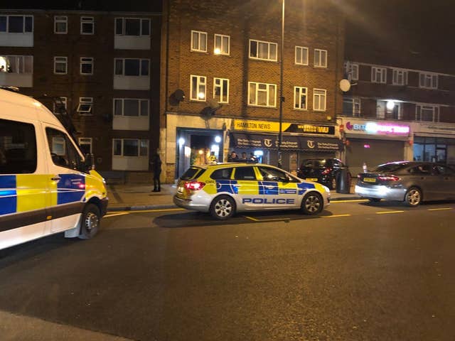 Police at the scene outside Queensbury Tube station (@keval_91/PA)