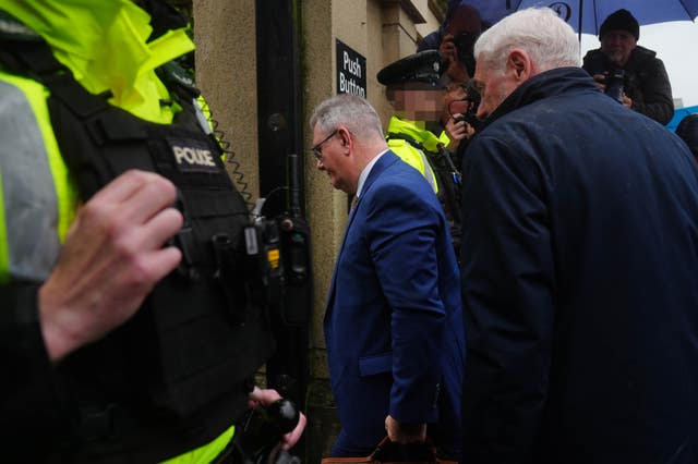Sir Jeffrey Donaldson enters a building