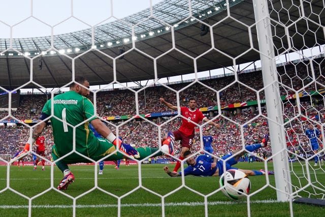 Switzerland’s Remo Freuler scores the opening goal of the game