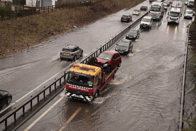 Traffic passes through water on the A66 near Bowes in County Durham