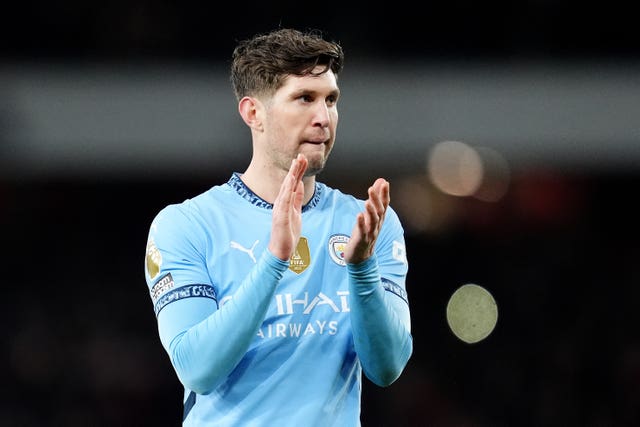 Manchester City's John Stones applauds fans after a game