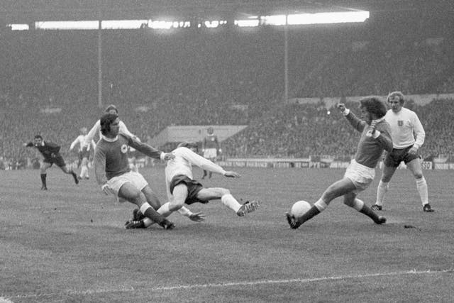 Bell, centre, is closed down by West Germany's Gerd Muller, left, and Paul Breitner, right, in England's defeat at the 1972 European Championship