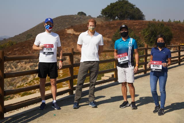 The Duke of Sussex, Patron of the London Marathon Charitable Trust, poses with runners in Los Angeles before they take on the virtual Virgin Money London Marathon