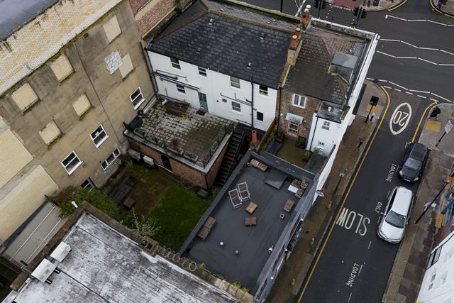 A view of the shared back garden of two neighbouring properties on Bethnal Green Road, east London, where the family of Muriel McKay believe her remains are buried