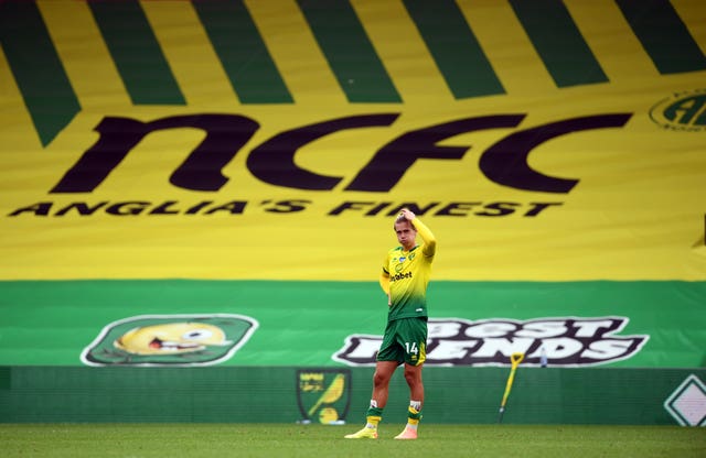 Todd Cantwell stands dejected after the loss to Brighton