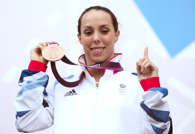 Beth Tweddle shows off her bronze medal won in the women’s uneven bars in 2012
